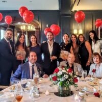 Mort-Zetlin-seated-in-center-and-family-photo-by-Peter-Wehmann-Arlington-Optimist-Club
